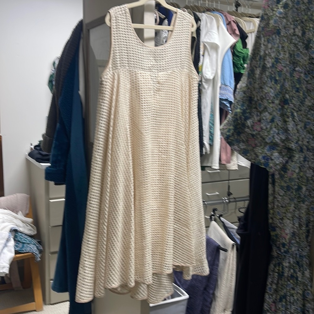 Milly silk tank dress with flirty fun hem.